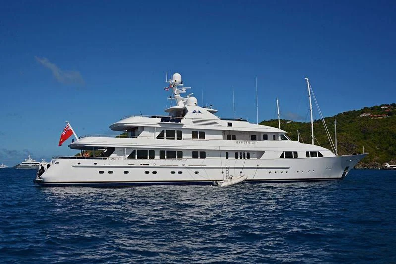 a large white boat in the water aboard AMBITION Yacht for Sale