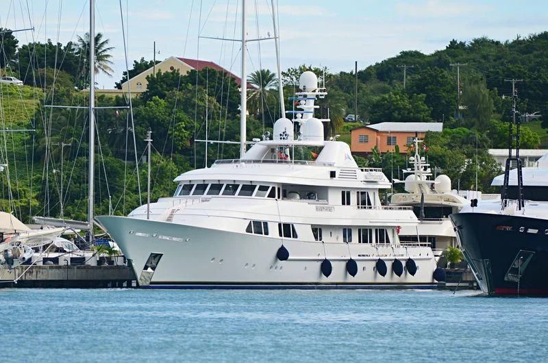 a white boat in the water aboard AMBITION Yacht for Sale