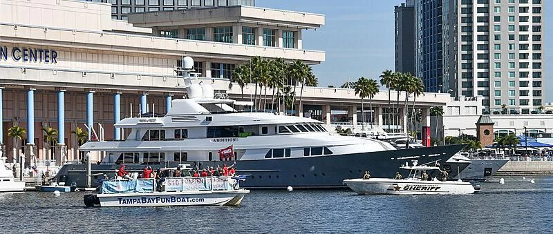 a large white boat in the water aboard AMBITION Yacht for Sale