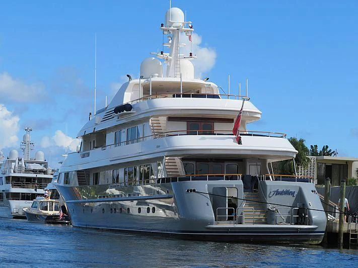 a large white boat in the water aboard AMBITION Yacht for Sale