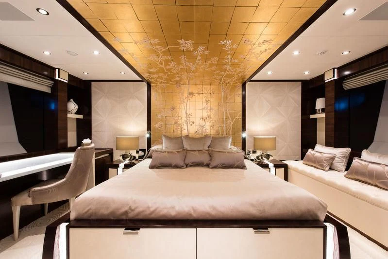 a room with a bed and a large mirror aboard SILVER WIND Yacht for Charter