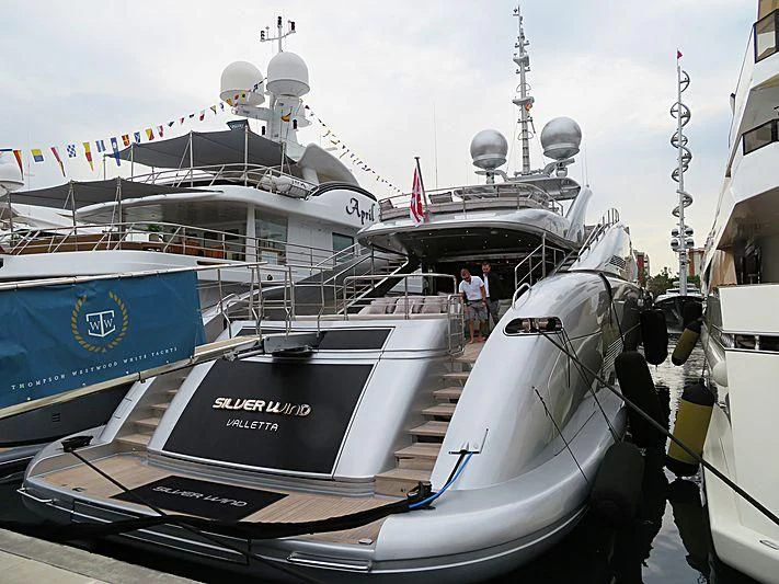 a boat docked at a pier aboard SILVER WIND Yacht for Charter