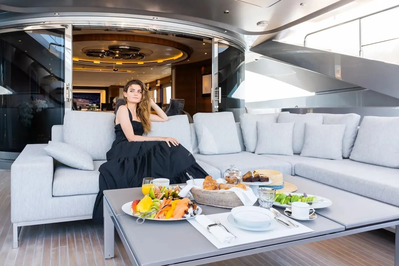 a person sitting on a couch in a car aboard SILVER WIND Yacht for Charter