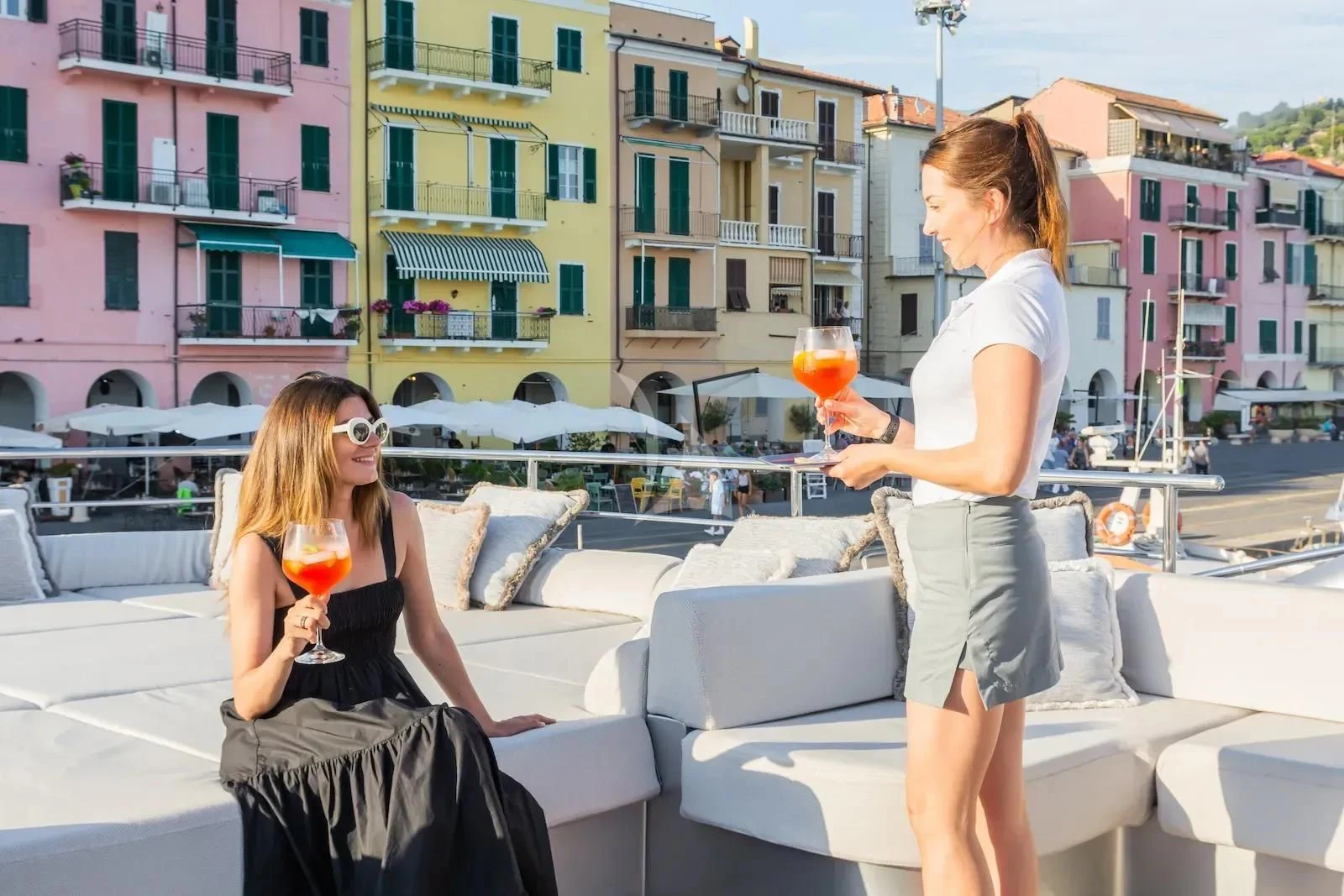a couple of women holding drinks aboard SILVER WIND Yacht for Charter