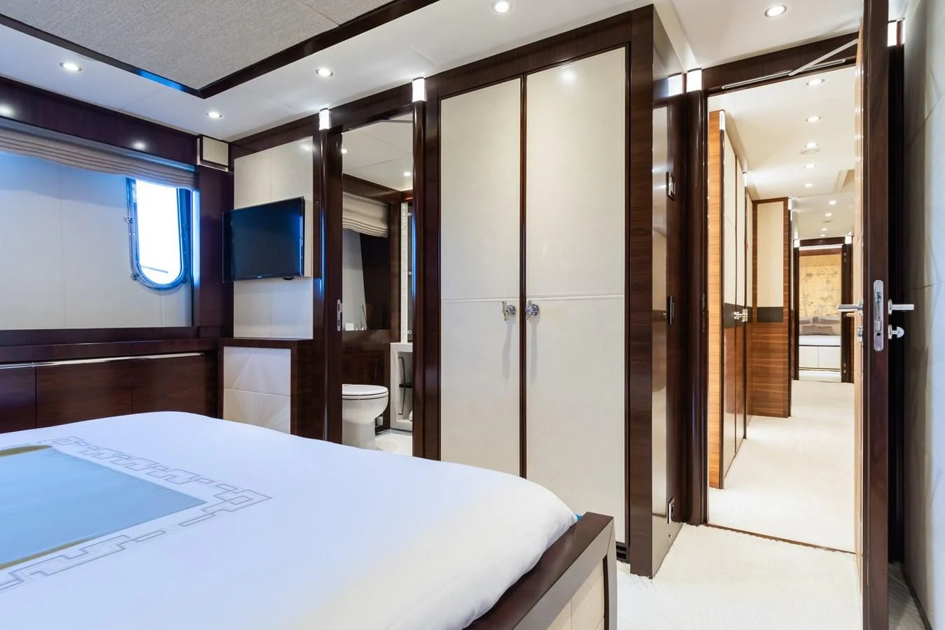 a room with a bed and a closet aboard SILVER WIND Yacht for Charter