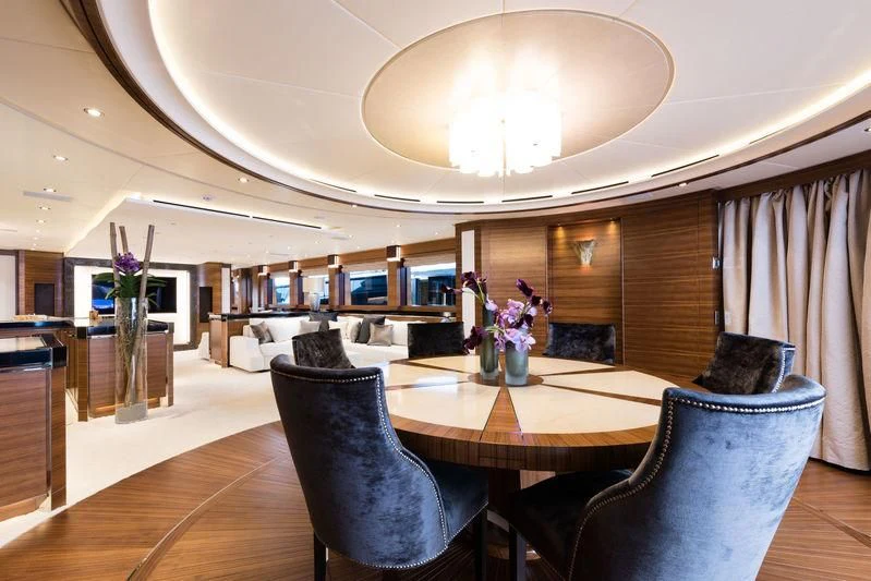 a large room with a table and chairs aboard SILVER WIND Yacht for Charter