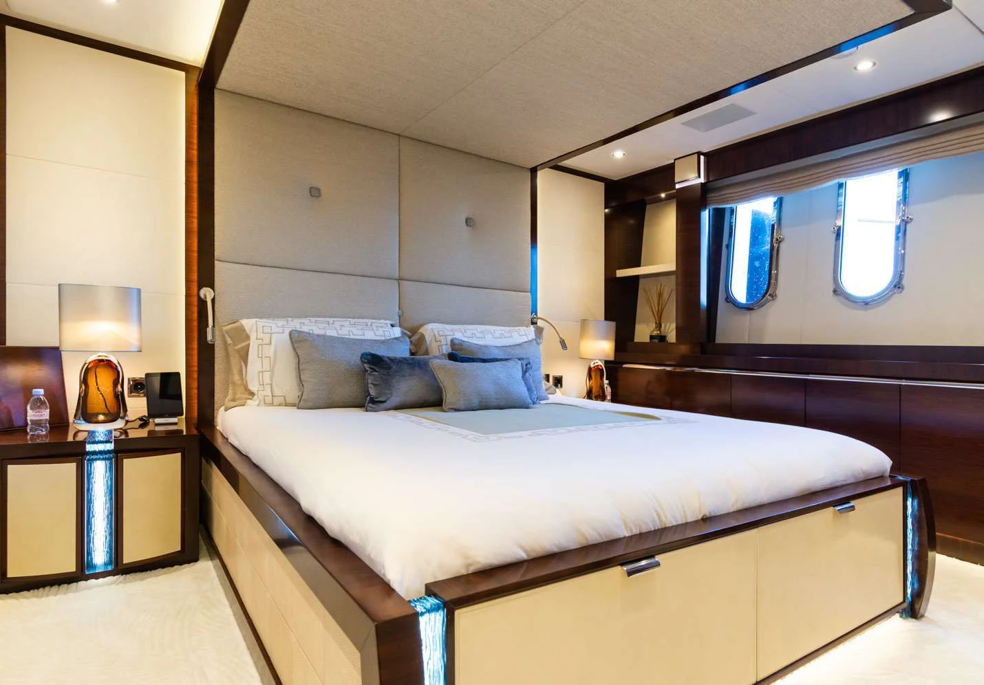 a bed with a blue pillow aboard SILVER WIND Yacht for Charter