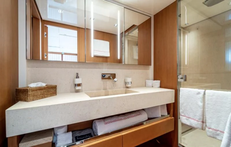 a bathroom with a sink and a mirror aboard BLUES Yacht for Sale