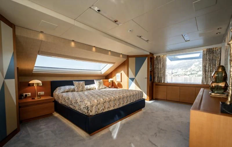a bedroom with a large bed aboard BLUES Yacht for Sale