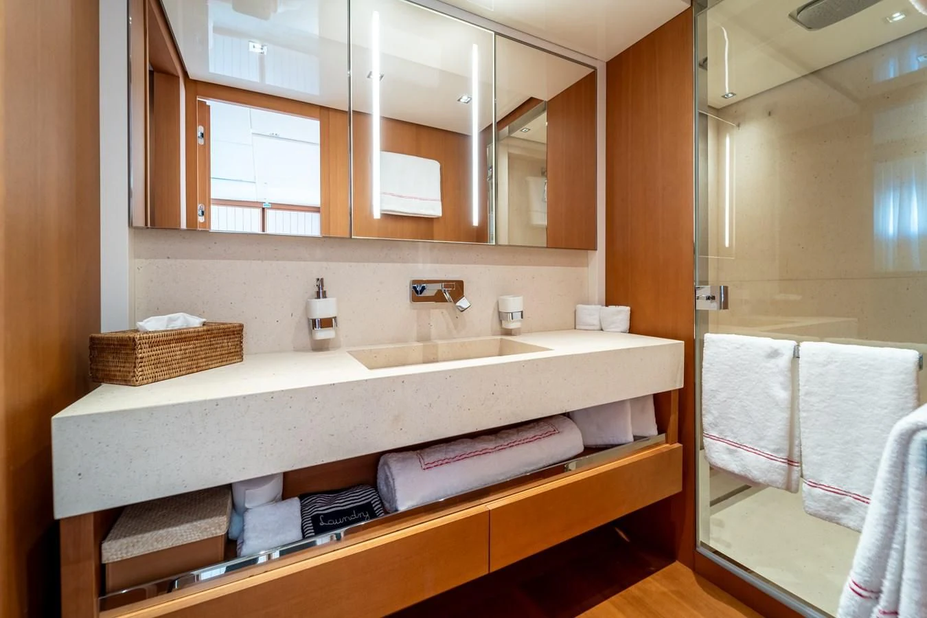 a bathroom with a sink and a mirror aboard BLUES Yacht for Sale