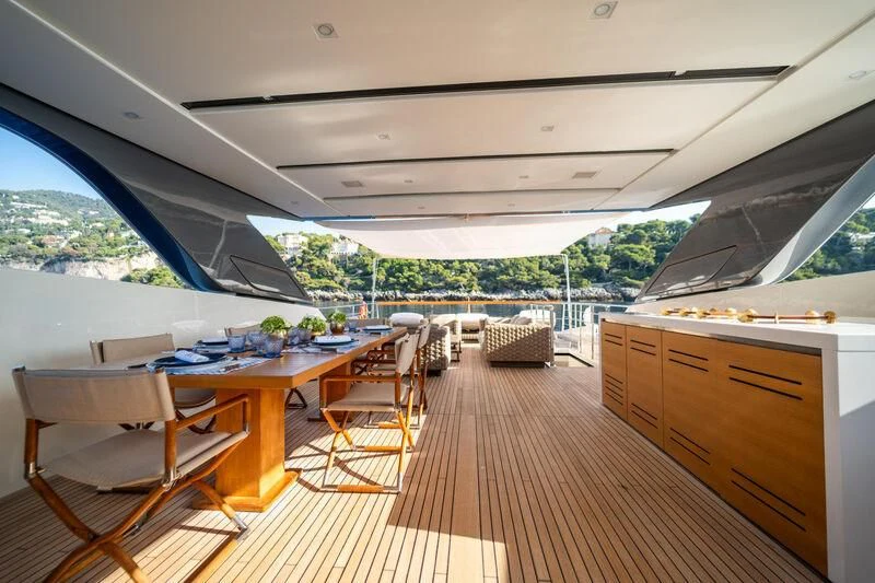a room with a table and chairs aboard BLUES Yacht for Sale