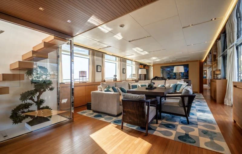 a living room with a large glass door aboard BLUES Yacht for Sale