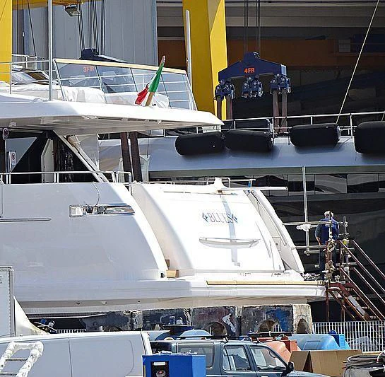 a large white boat with a group of people on it aboard BLUES Yacht for Sale