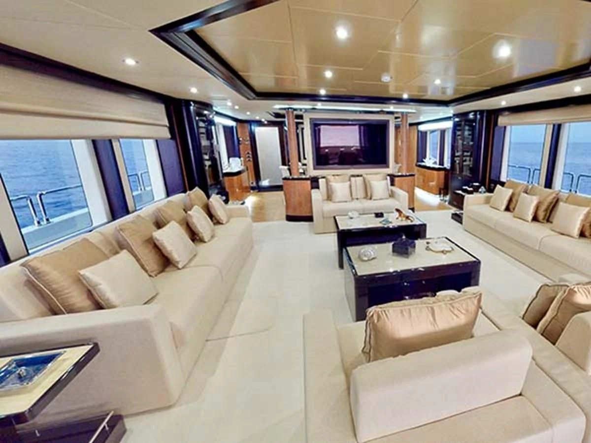 a living room with a large screen aboard AL WASMY I Yacht for Sale