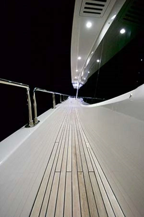 a wooden walkway with a railing aboard AL WASMY I Yacht for Sale