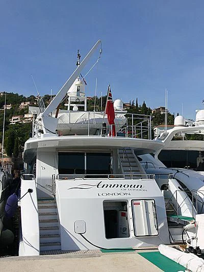 a boat with a flag on the deck aboard VERSE Yacht for Sale