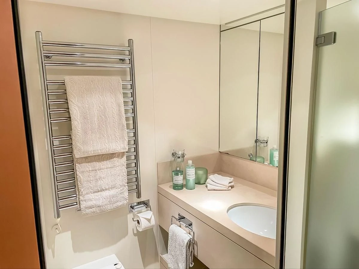 a bathroom with a towel rack aboard VERSE Yacht for Sale