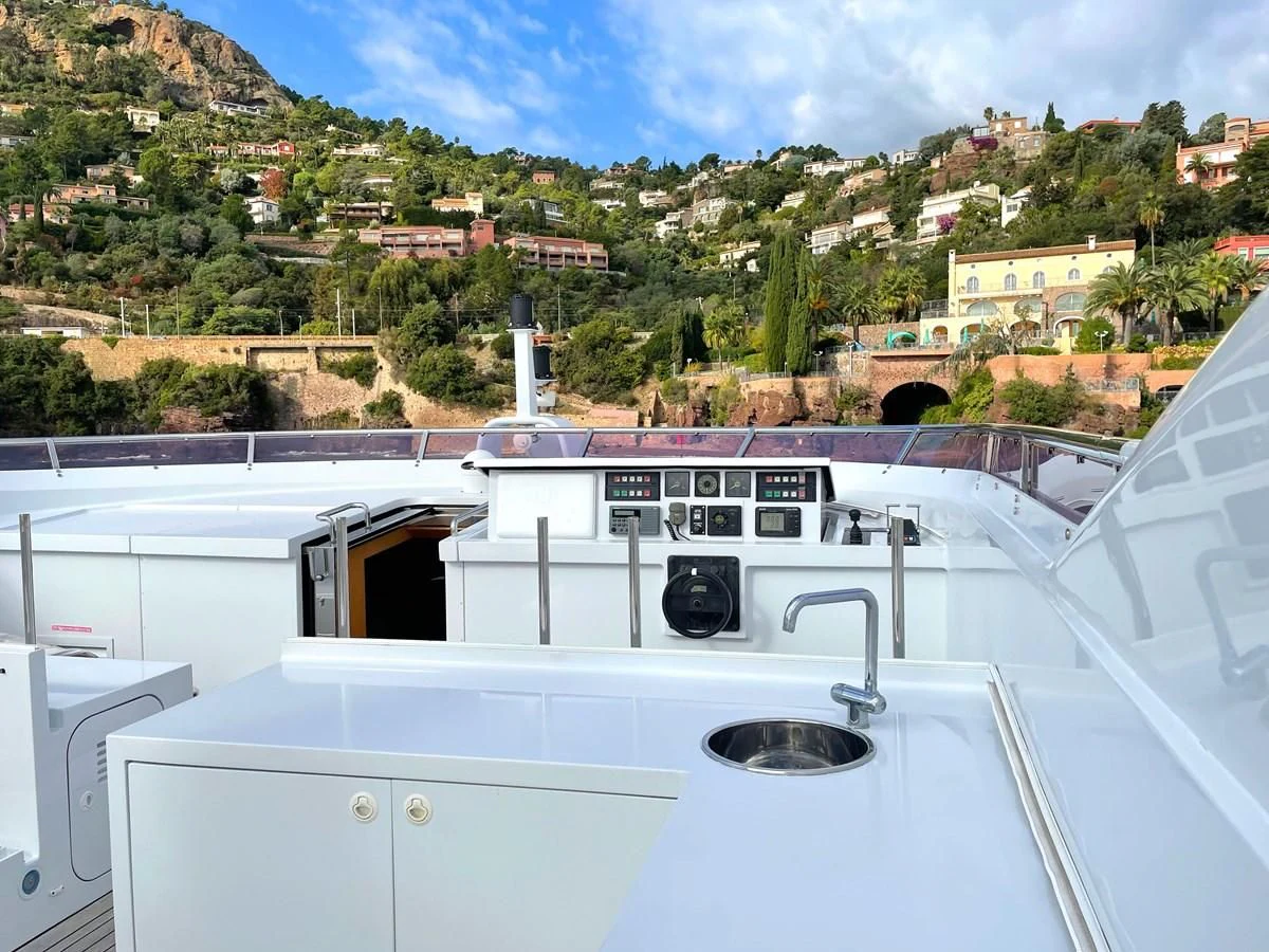 a white boat with a black object on it aboard VERSE Yacht for Sale