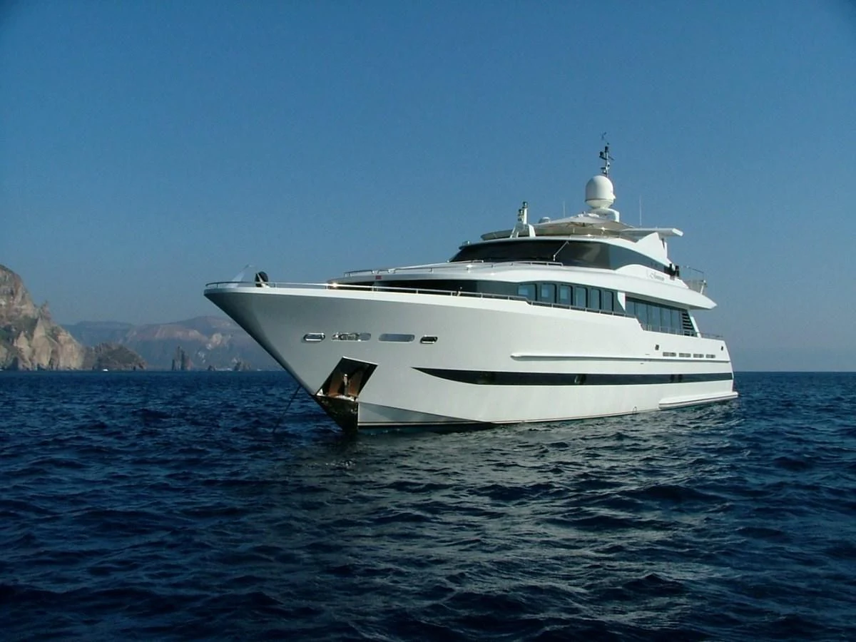 a white yacht in the water aboard VERSE Yacht for Sale