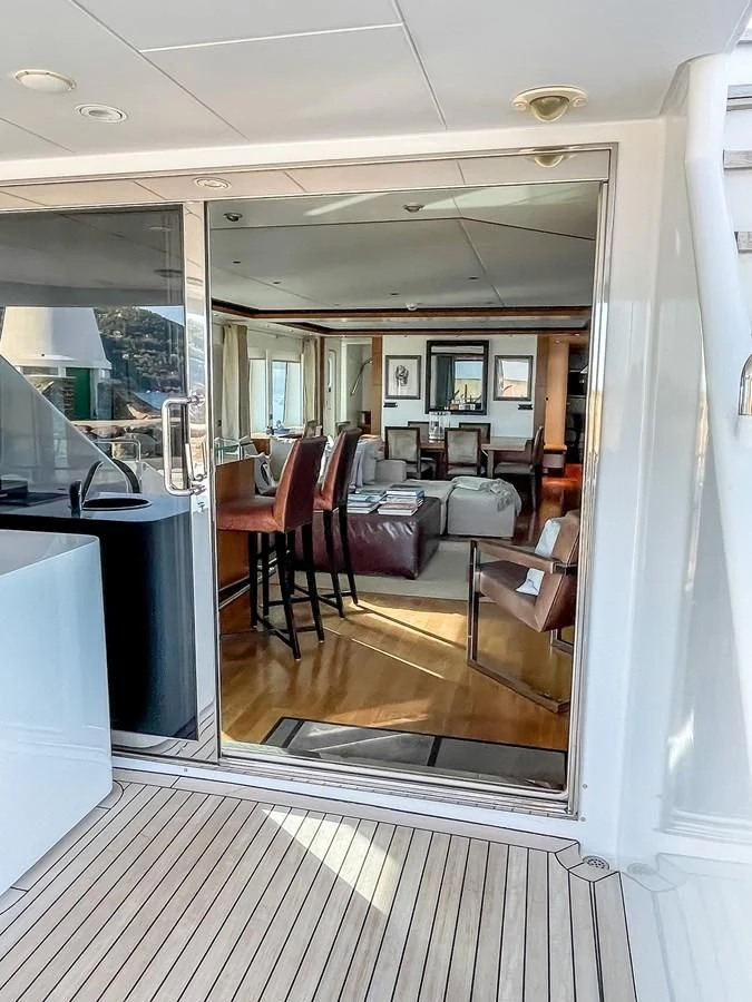 inside of a vehicle with chairs and tables aboard VERSE Yacht for Sale