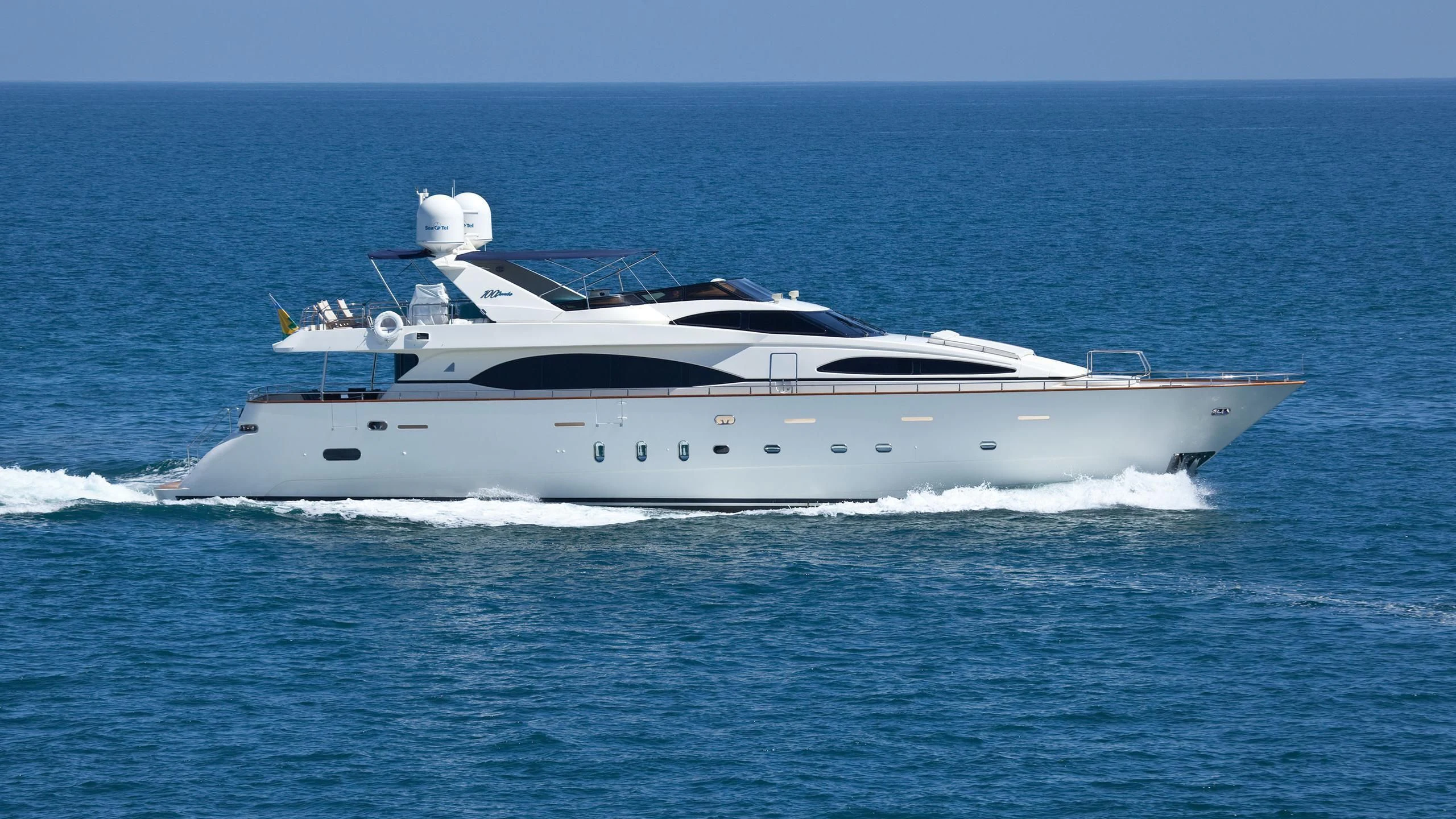 a white yacht in the water aboard SUPER Yacht for Charter