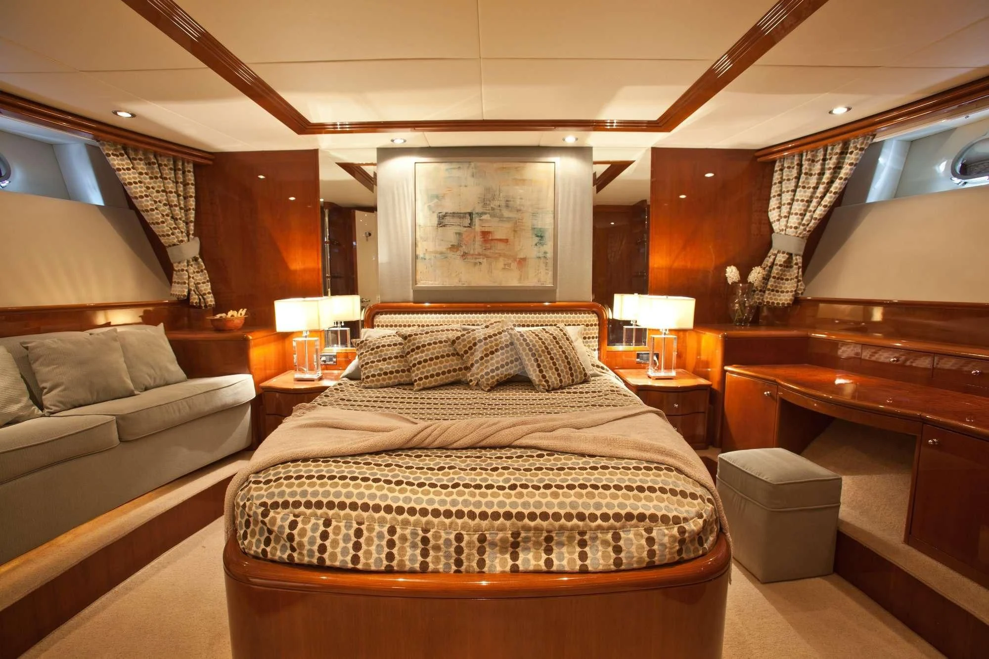 a bed in a room aboard SUPER Yacht for Charter
