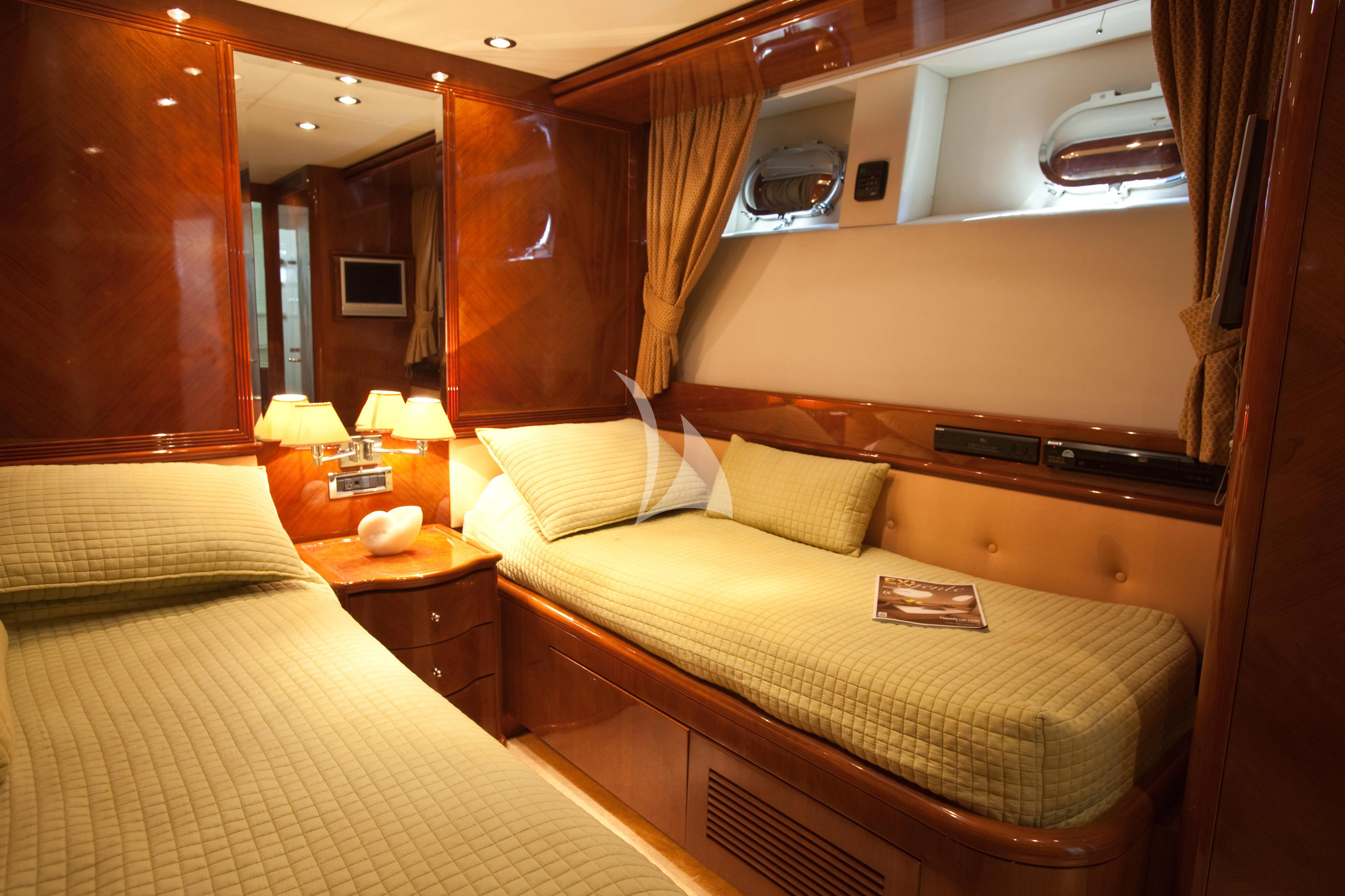 a room with two beds aboard SUPER Yacht for Charter