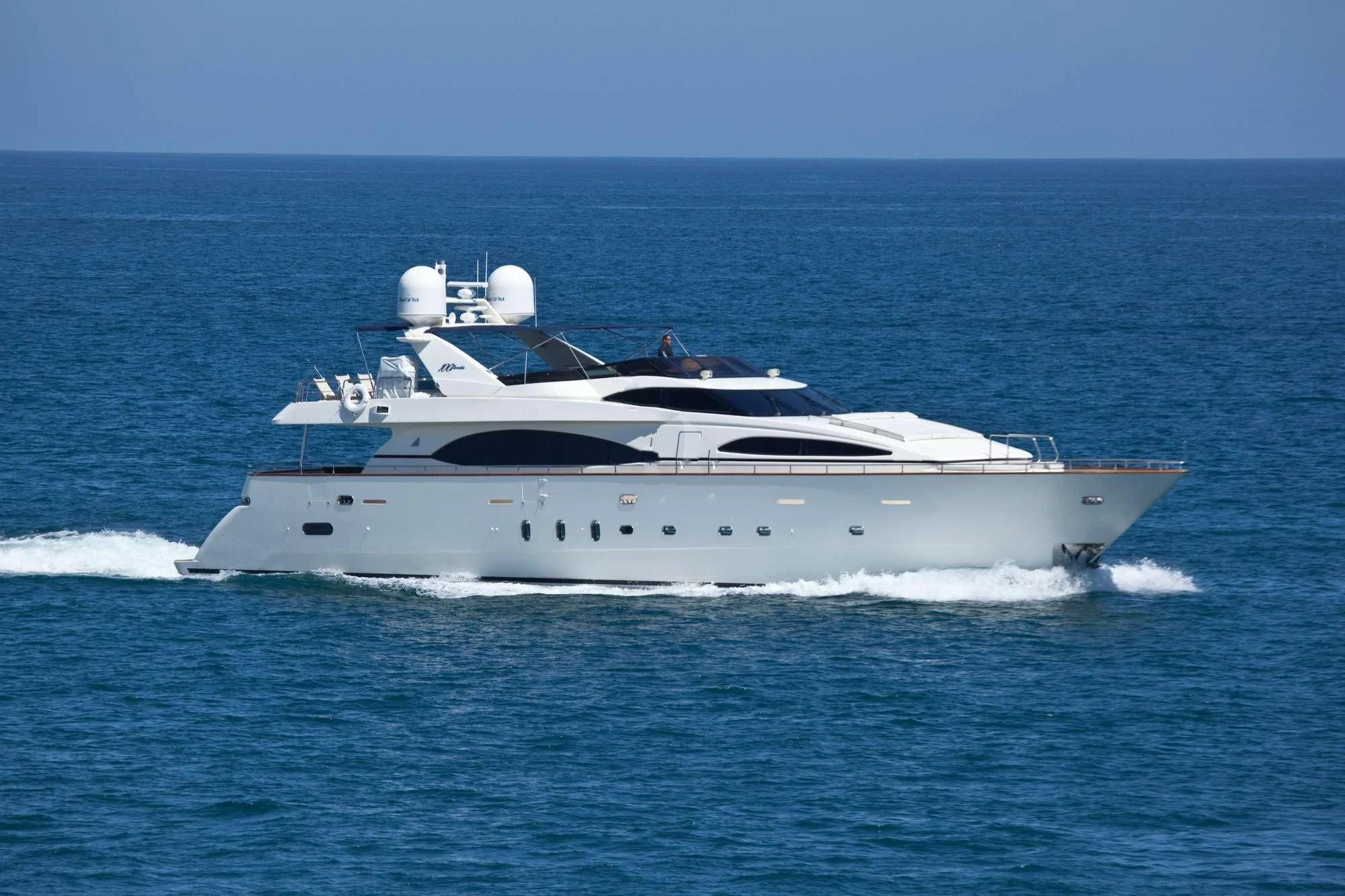 a white yacht on the water aboard SUPER Yacht for Charter