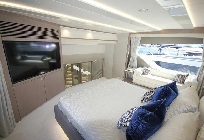 a room with a bed and a television aboard AMOUR I Yacht for Sale