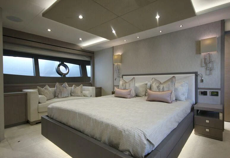 a bedroom with a large bed aboard AMOUR I Yacht for Sale