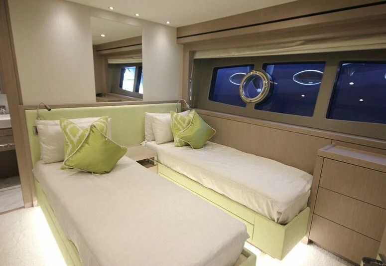 a room with a bed and a window aboard AMOUR I Yacht for Sale