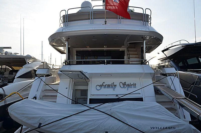 a boat with a flag on the front aboard AMOUR I Yacht for Sale