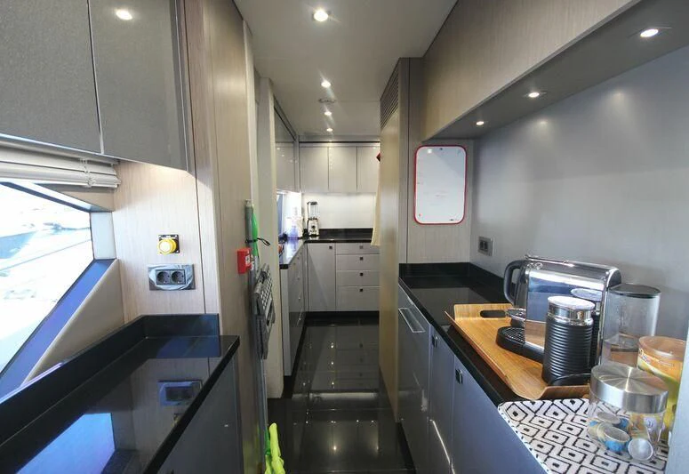 a kitchen with a countertop aboard AMOUR I Yacht for Sale