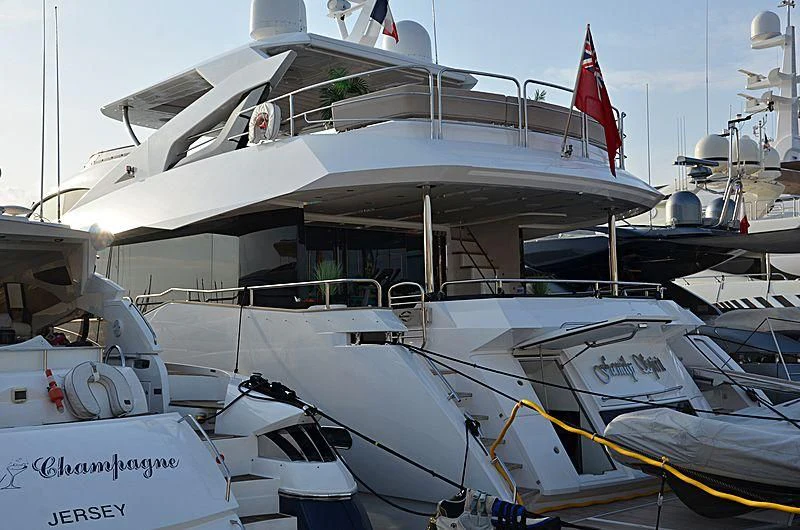 a boat docked at a pier aboard AMOUR I Yacht for Sale