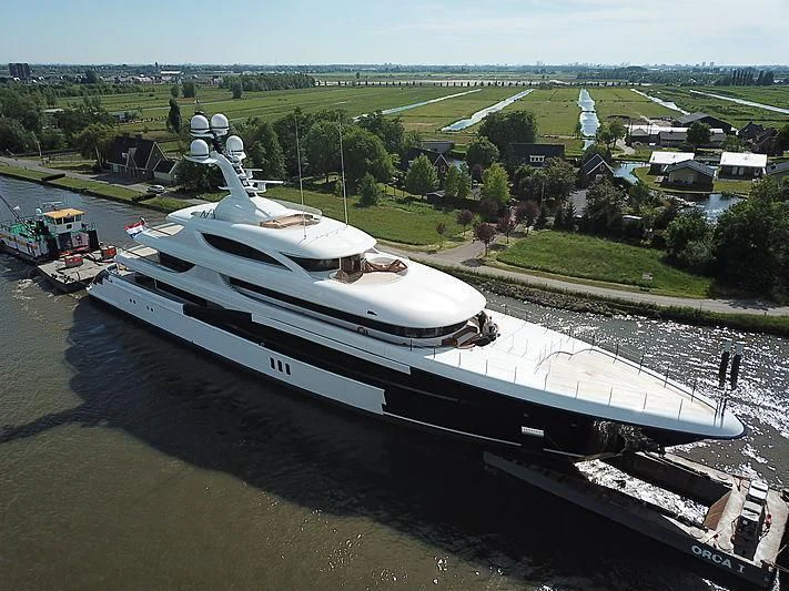 a ship docked at a port aboard PODIUM Yacht for Sale
