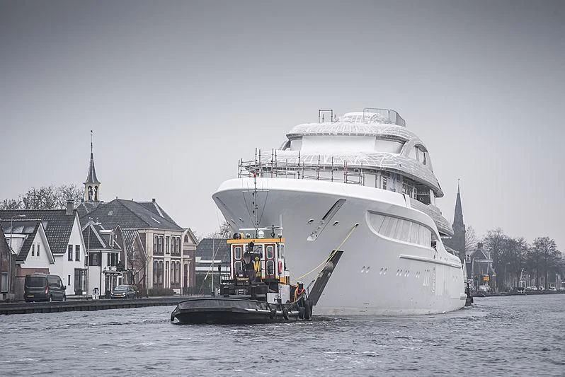 a large white ship in the water aboard PODIUM Yacht for Sale