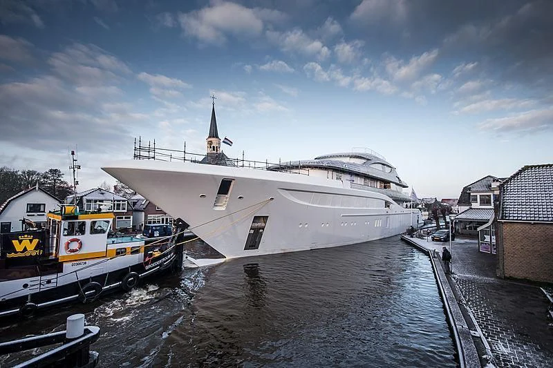 a boat docked at a pier aboard PODIUM Yacht for Sale