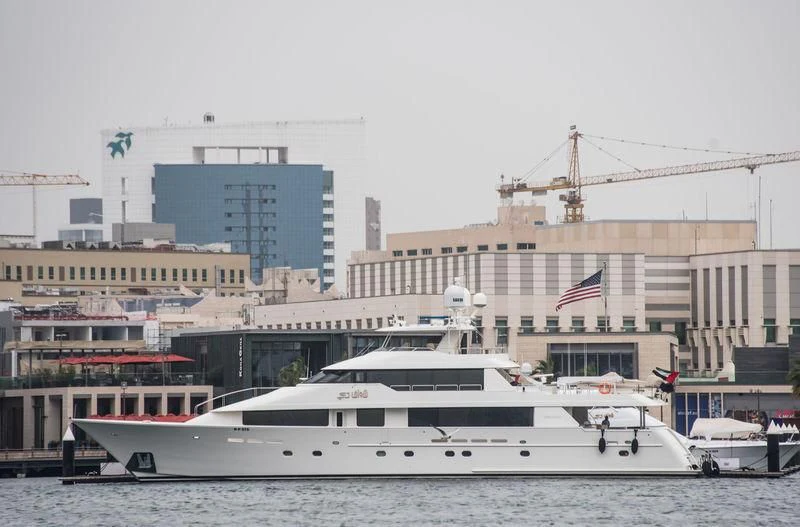 a large white boat in a harbor aboard SHAWAF DUBAI Yacht for Sale