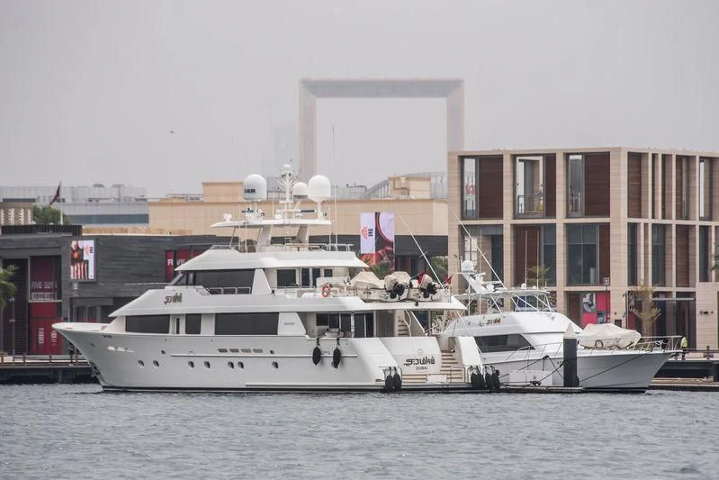 a boat docked in front of a building aboard SHAWAF DUBAI Yacht for Sale