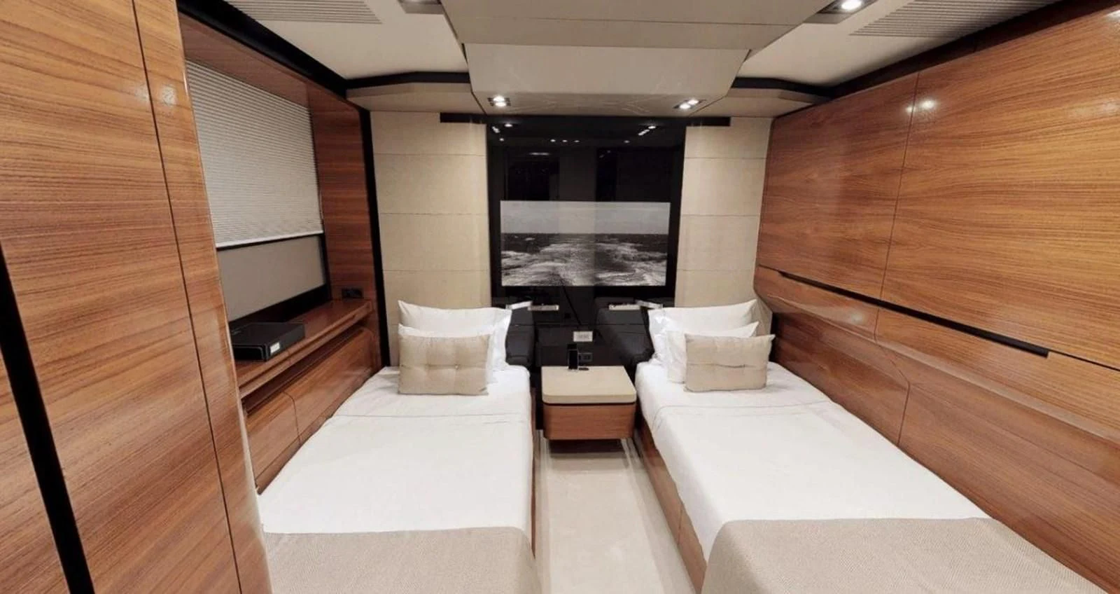 a room with a bed and a tv aboard FUSION Yacht for Charter