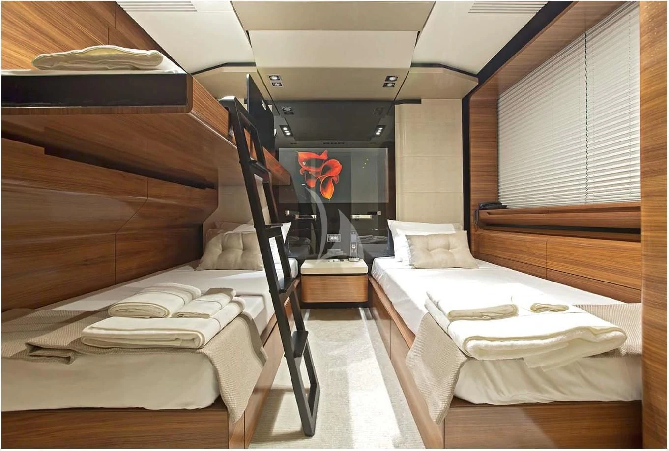 a room with a bed and a piano aboard FUSION Yacht for Charter