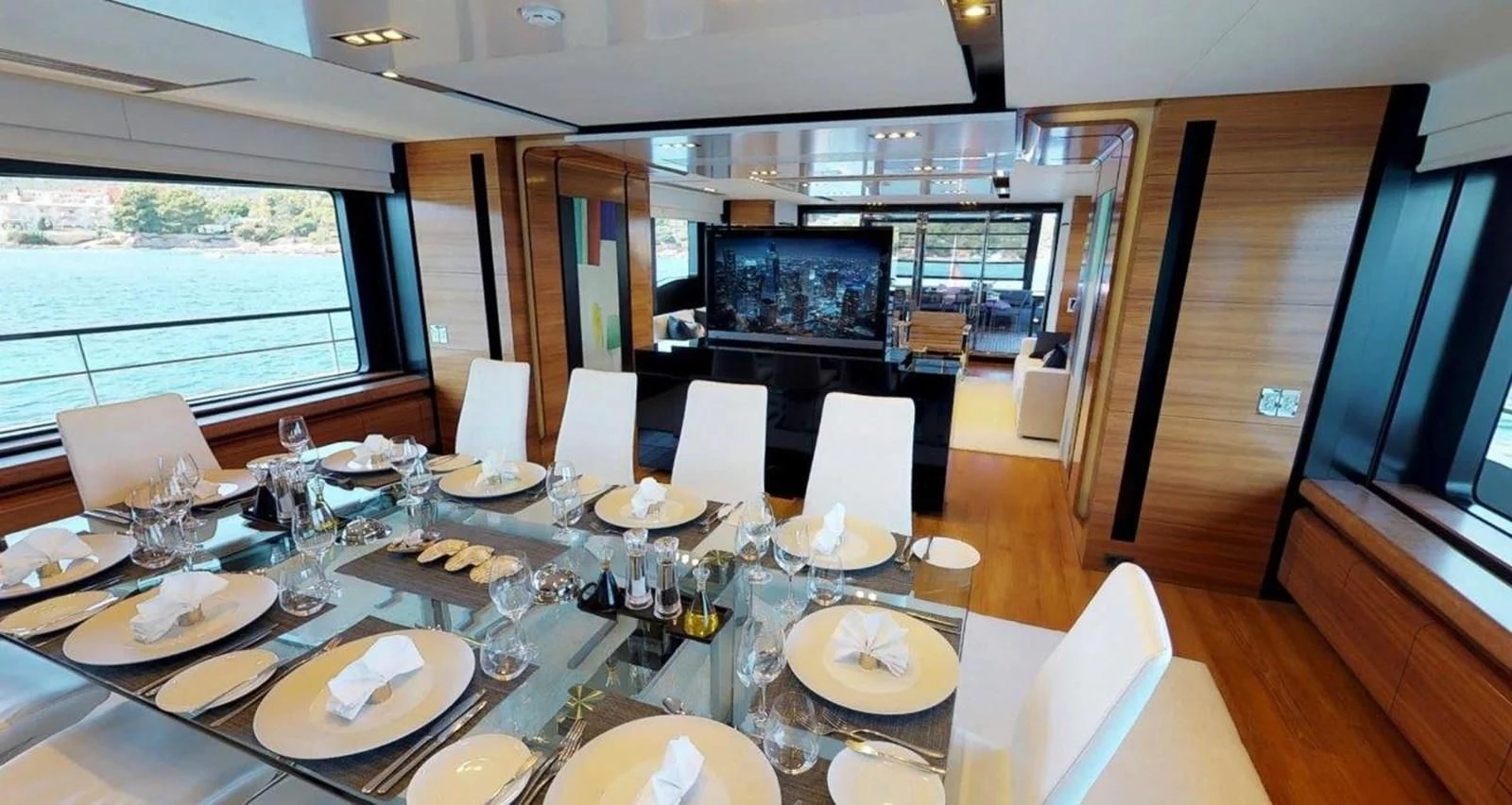 a dining room with a table set aboard FUSION Yacht for Charter