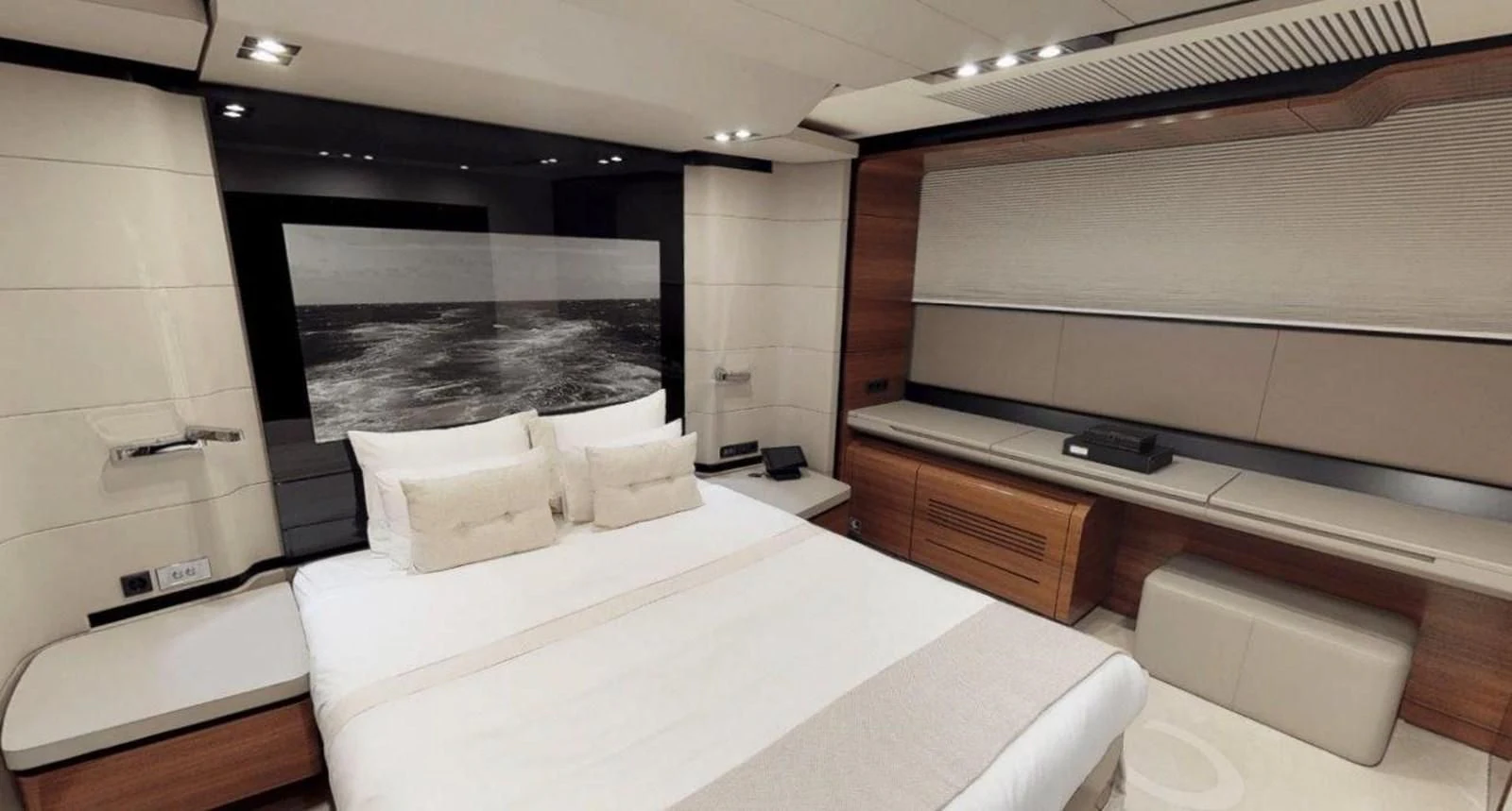 a room with a bed and a desk aboard FUSION Yacht for Charter