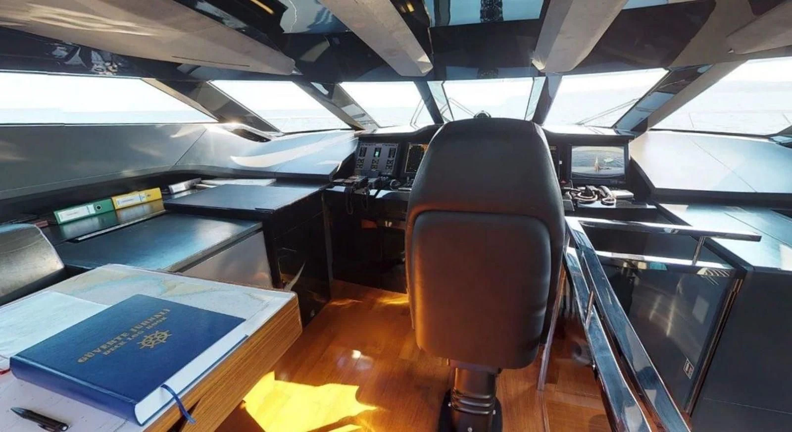 a room with computers and books aboard FUSION Yacht for Charter