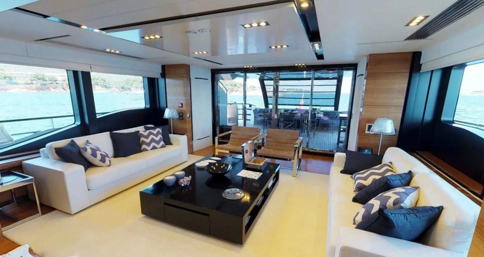 a living room with a large window aboard FUSION Yacht for Charter