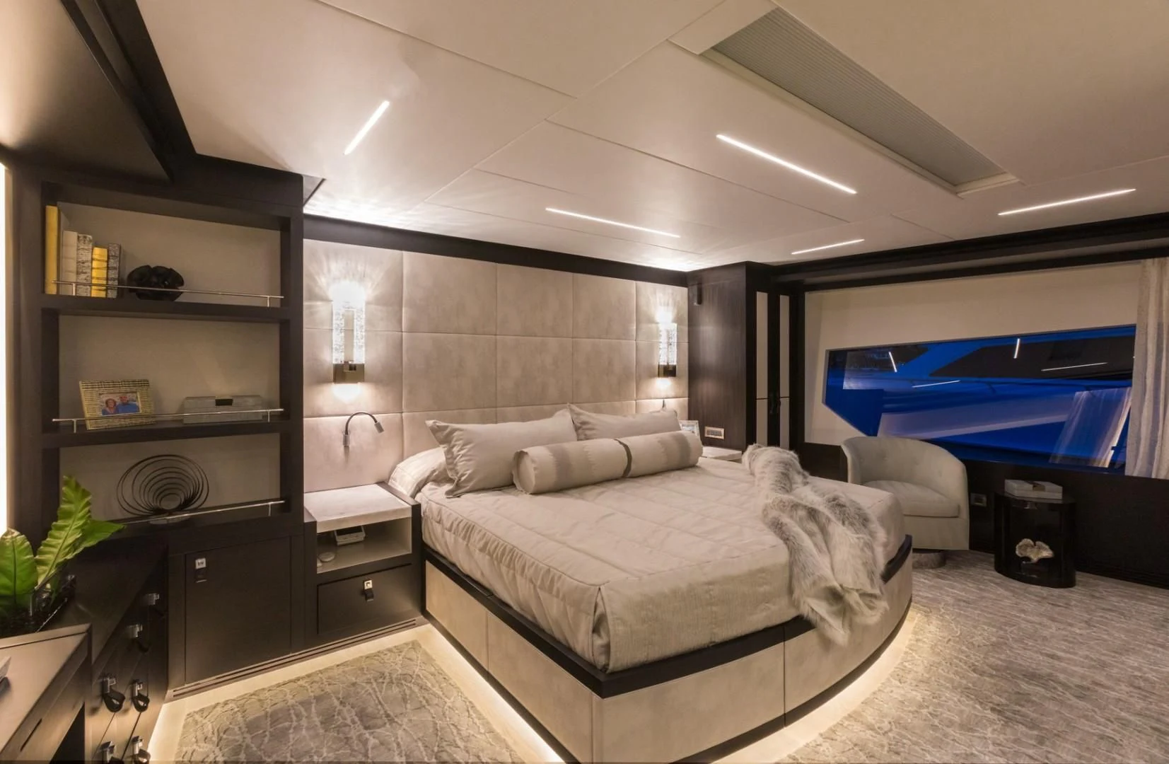 a bedroom with a bed and a tv aboard GG Yacht for Sale