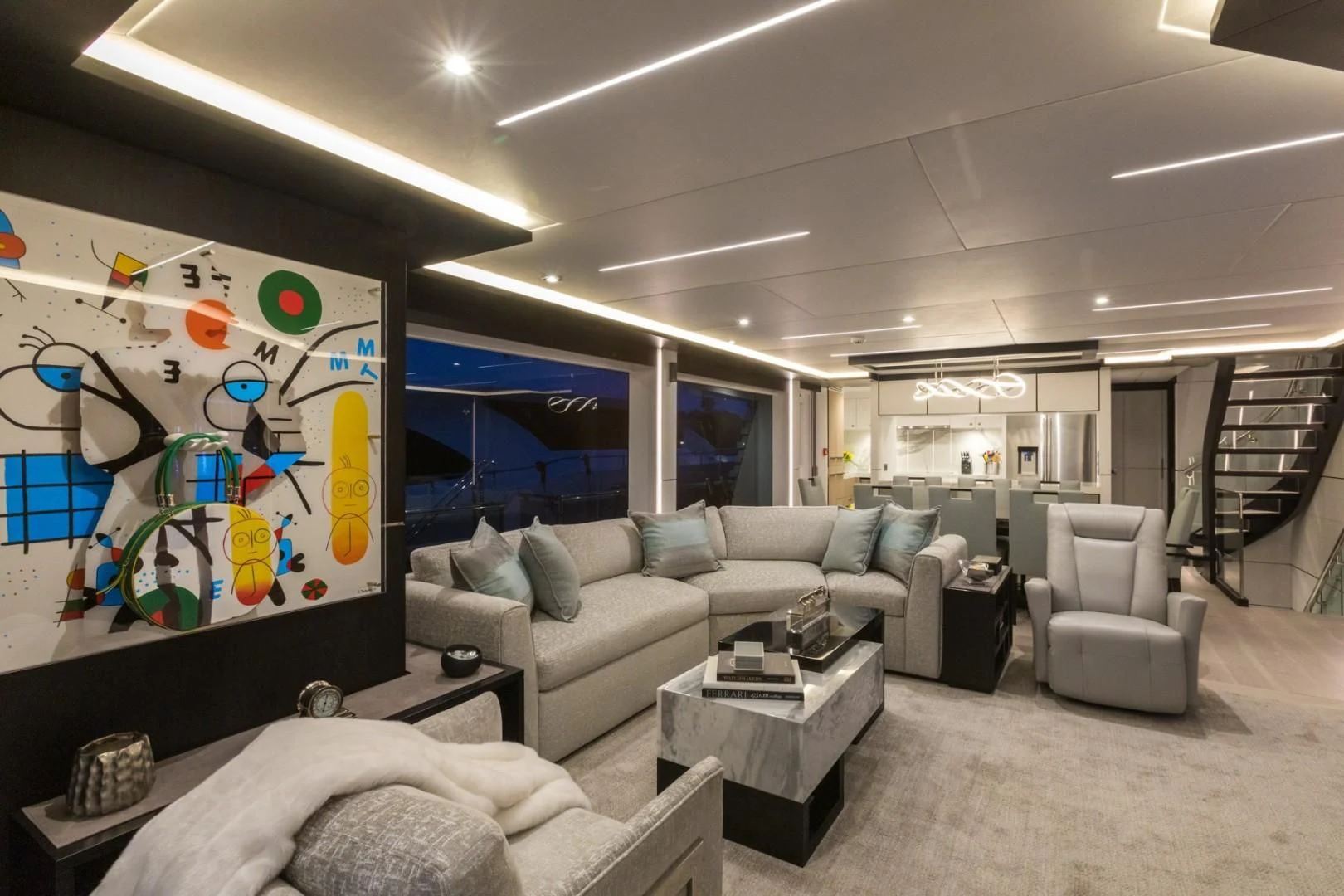 a living room with a large screen aboard GG Yacht for Sale