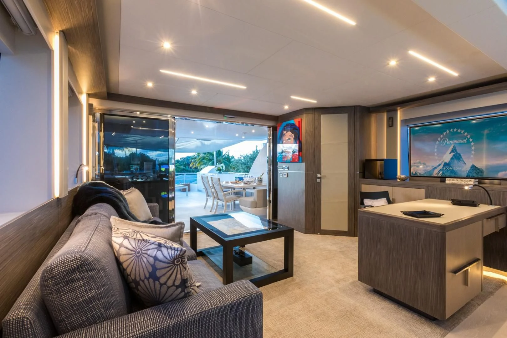 a living room with a large window aboard GG Yacht for Sale