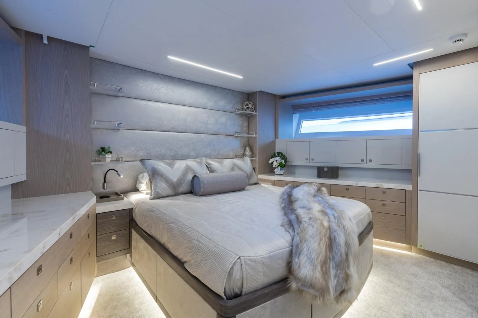 a bedroom with a large bed aboard GG Yacht for Sale