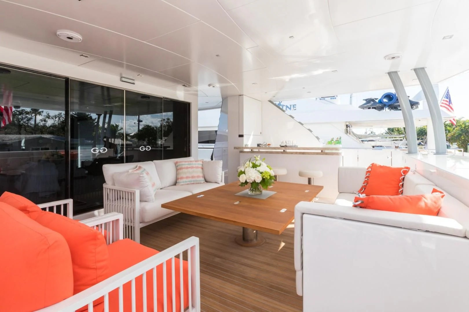 a living room with a table and chairs aboard GG Yacht for Sale